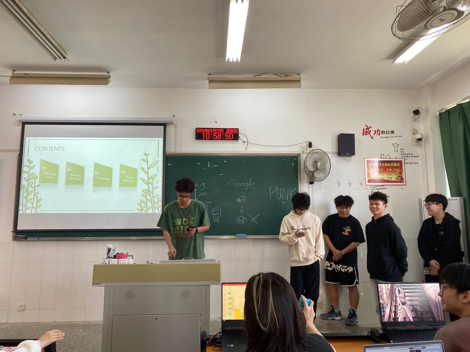 Students presenting their web development final project at Yango University in Fuzhou China