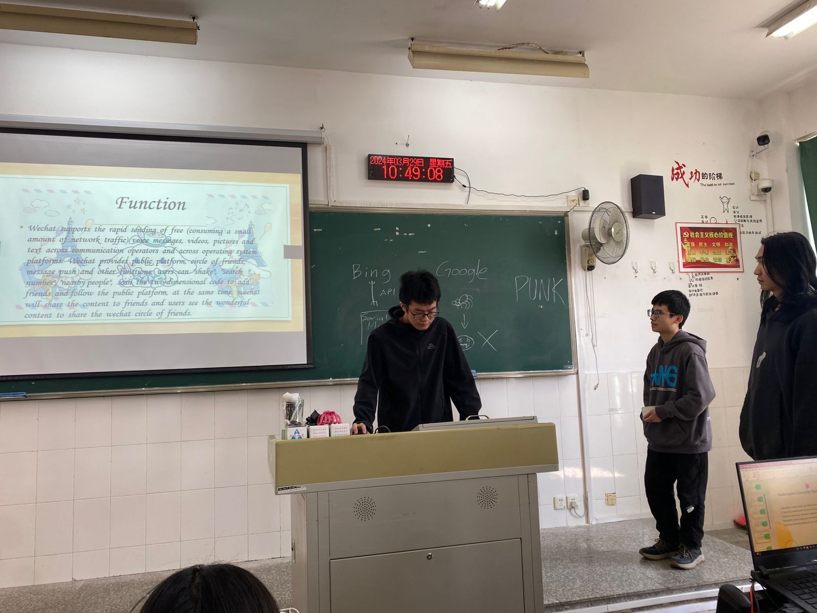Student presenting web development project and topic at Yango University class